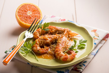 shrimp with orange and lemon sauce, selective focus