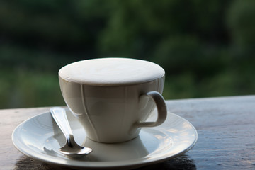 Cup of fresh espresso coffee foam on wooden table, Evening scene, Morning scene, Macro image