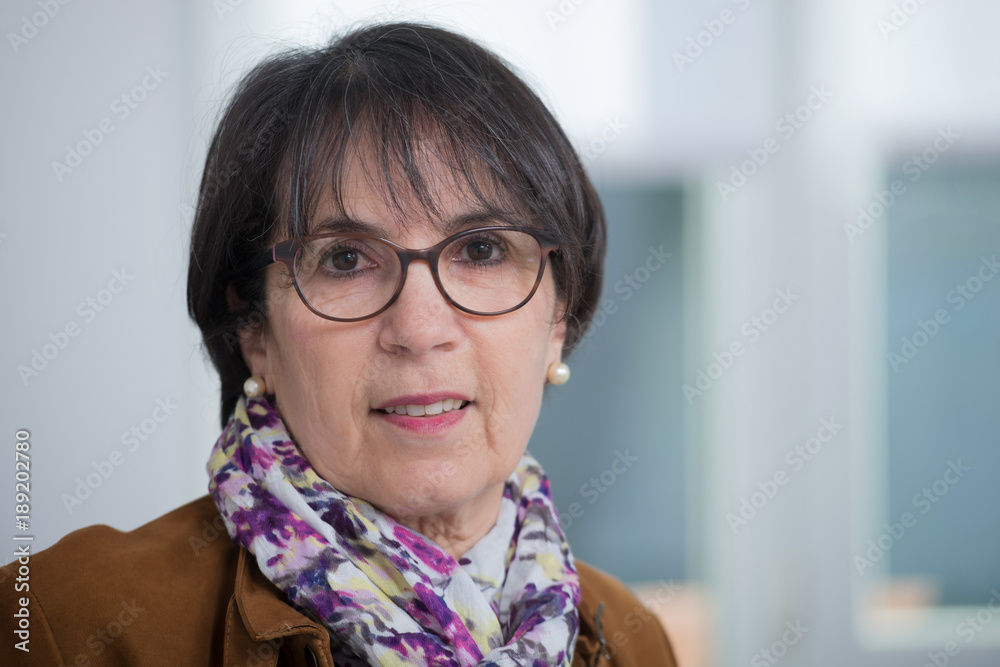 Wall mural portrait of middle age brunette with glasses