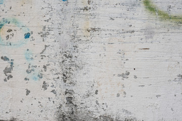 Wall fragment with scratches and cracks