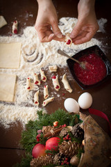 Fototapeta na wymiar hand confectioner making cookies for Christmas.
