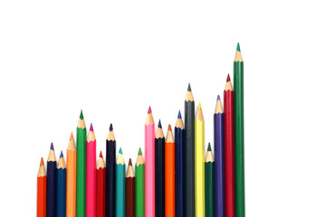 Growth chart of colored pencils on white background