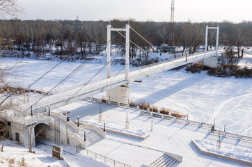 Pedestrian bridge over the Ural River in Orenburg / Photo taken in Russia, in the winter 01/10/2018