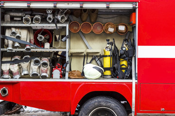 The fire truck is red. Fire and rescue equipment in a fire truck.