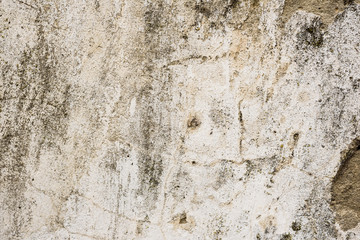 Wall fragment with scratches and cracks