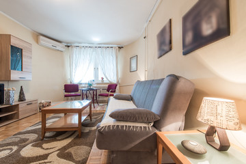 Side view of couch and table in flat interior