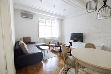 Bright spacious living room with chairs table inside