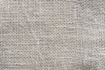 Fototapeta na wymiar beige creased linen fabric texture background