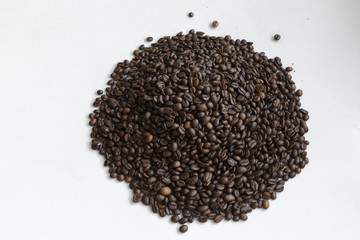 Full Frame Shot of Roasted Coffee Beans. Texture of coffee beans as background. White background.
