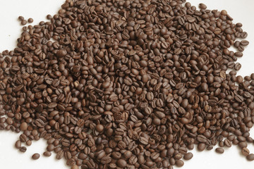 Full Frame Shot of Roasted Coffee Beans. Texture of coffee beans as background. White background.