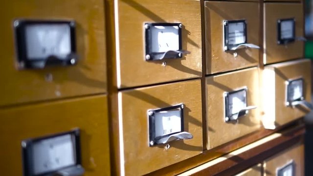 Archival filing systems in the library. Wooden boxes with cards.