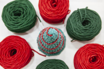 christmas tree made of green and red wool
