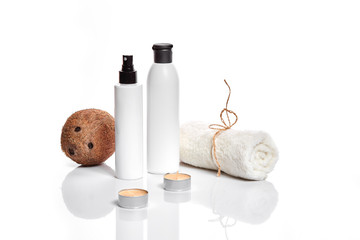 Organic cosmetics with coconut on white background.