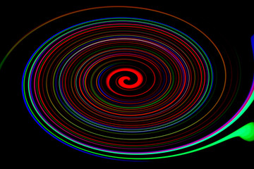 Abstract colorful circles glow over black