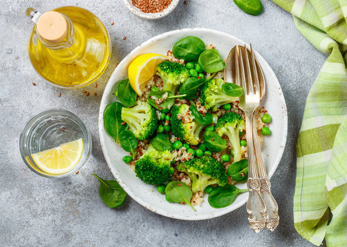 Quinoa with broccoli, spinach, peas, lemon and flax  seeds with olive oil. Detox warm or cold salad from green vegetables. Healthy meals, diet. Selective focus