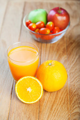 Healthy concept with mixed fruits and vegetables on wooden background