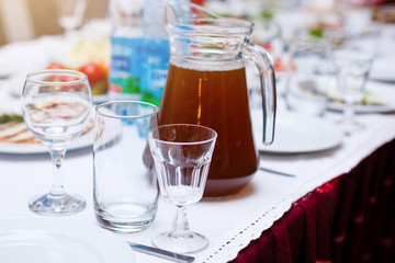 Beautiful glasses defocused on buffet table in restaurant and blurred background