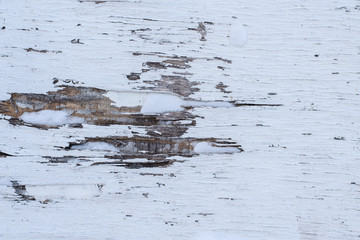 Old rustic wooden background painted with white paint