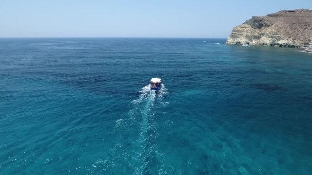 4K Drone Shot Of A Boat Sailing Near Santorini Island, Greece