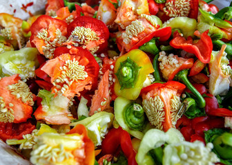 A lot of colorful paprika or peper with seeds