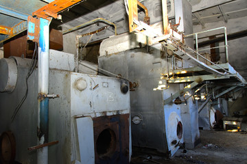 Old equipment for milk production. Premises of a destroyed and plundered milk production plant. The raiders captured the plant. Vandalism. Ukraine, January 2018.