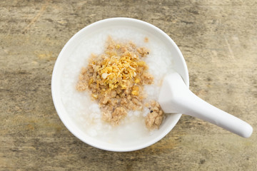 Top view of Mush morning, mush in white bowl on the wooden table,Thai food
