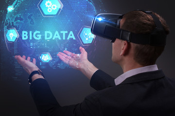 Business, Technology, Internet and network concept. Young businessman working on a virtual screen of the future and sees the inscription: Big data