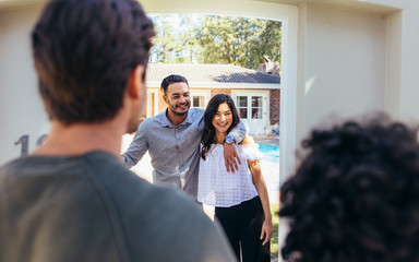 Couple attending friend's housewarming party