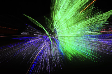 abstract perspective background of bright neon lights on a black background