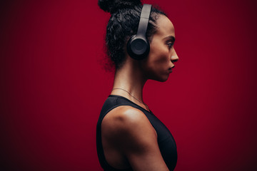 Fitness woman in sportswear and headphones
