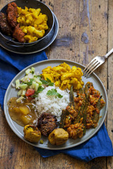Indian meal with aloo gobi, okra curry, rice and pakoras