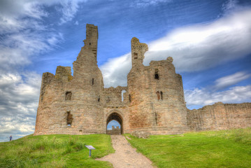 Fototapeta na wymiar English medieval castle Dunstanburgh Northumberland England uk in colourful hdr