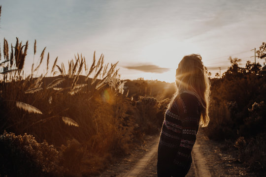 Woman in Sweater in Canyon with Golden Hour Light