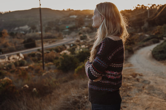 Woman in Sweater in Canyon with Golden Hour Light