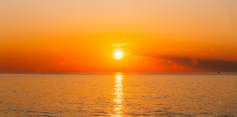 Sun Is Setting On Horizon At Sunset Sunrise Over Sea Or Ocean.