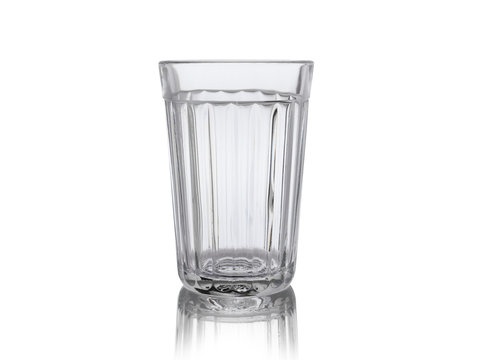 Empty faceted glass with reflection, isolated on white background