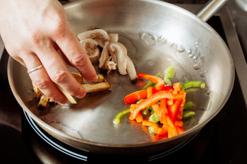 Roasting vegetables and mushrooms.