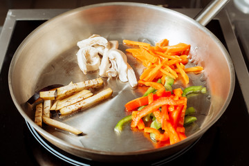 Roasting vegetables and mushrooms.
