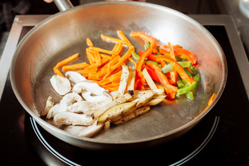 Roasting vegetables and mushrooms.