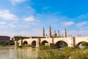 Fototapeta premium The Cathedral-Basilica of Our Lady of Pillar - a roman catholic church, Zaragoza, Spain. Copy space for text.
