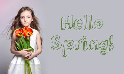 Hello Spring, 8 march. Fashion red-haired girl with tulips in hands. Studio photo on light coloured background. Spring day, Birthday, holiday, mother's day, first day of school