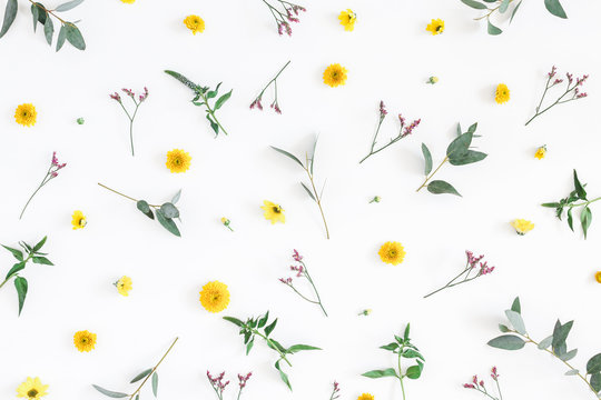 Flowers composition. Pattern made of yellow and pink flowers on white background. Flat lay, top view