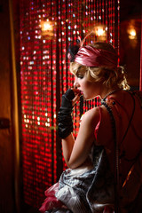 Retro portrait of a beautiful Gatsby woman. Vogue fashion style and smoke