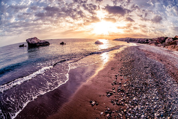 Seascape sunset near Petra tou Romiou. Paphos District, Cyprus