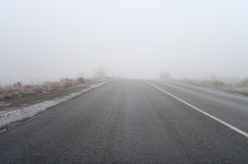 Empty road in thick fog.