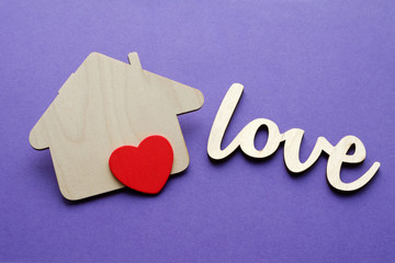 wooden house shape with red heart