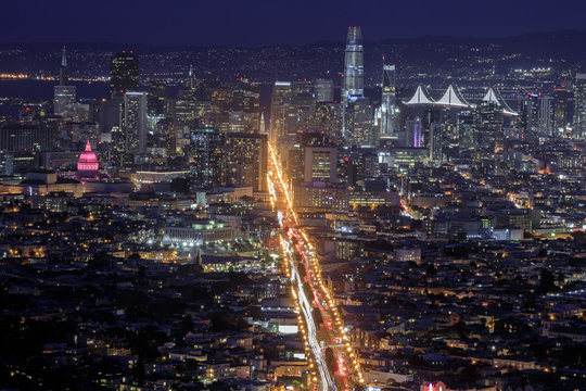 San Francisco City Lights. Views from Twin Peaks of Market Street splits San Francisco Downtown on a clear winter night.