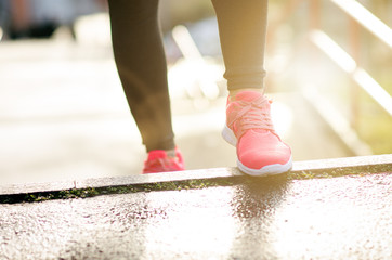 Close up of woman´s sports shoes. Young woman running up stairs. Healthy lifestyle. Fitness sport. Cardio training
