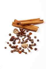 Spices for mulled wine. Spices for mulled wine isolated white background. Cinnamon sticks, roast pepper, ginger, tubberry, nutmeg, cardamom, cloves.