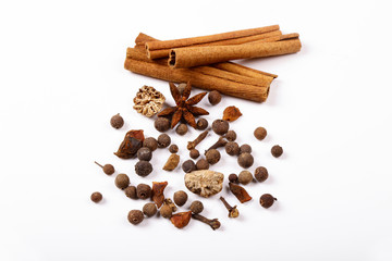 Spices for mulled wine. Spices for mulled wine isolated white background. Cinnamon sticks, roast pepper, ginger, tubberry, nutmeg, cardamom, cloves.